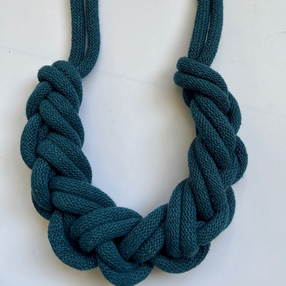 Thumbnail: close up of dark teal blue broaded rope necklace made from recycled cotton cord