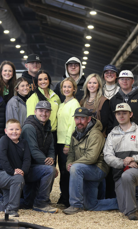 Group of smiling people in a barn