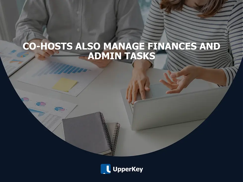 Two people reviewing charts and working on a laptop, illustrating Airbnb co-hosts managing finances and admin tasks