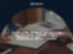 Signing a lease contract in Belgium with a laptop on the table