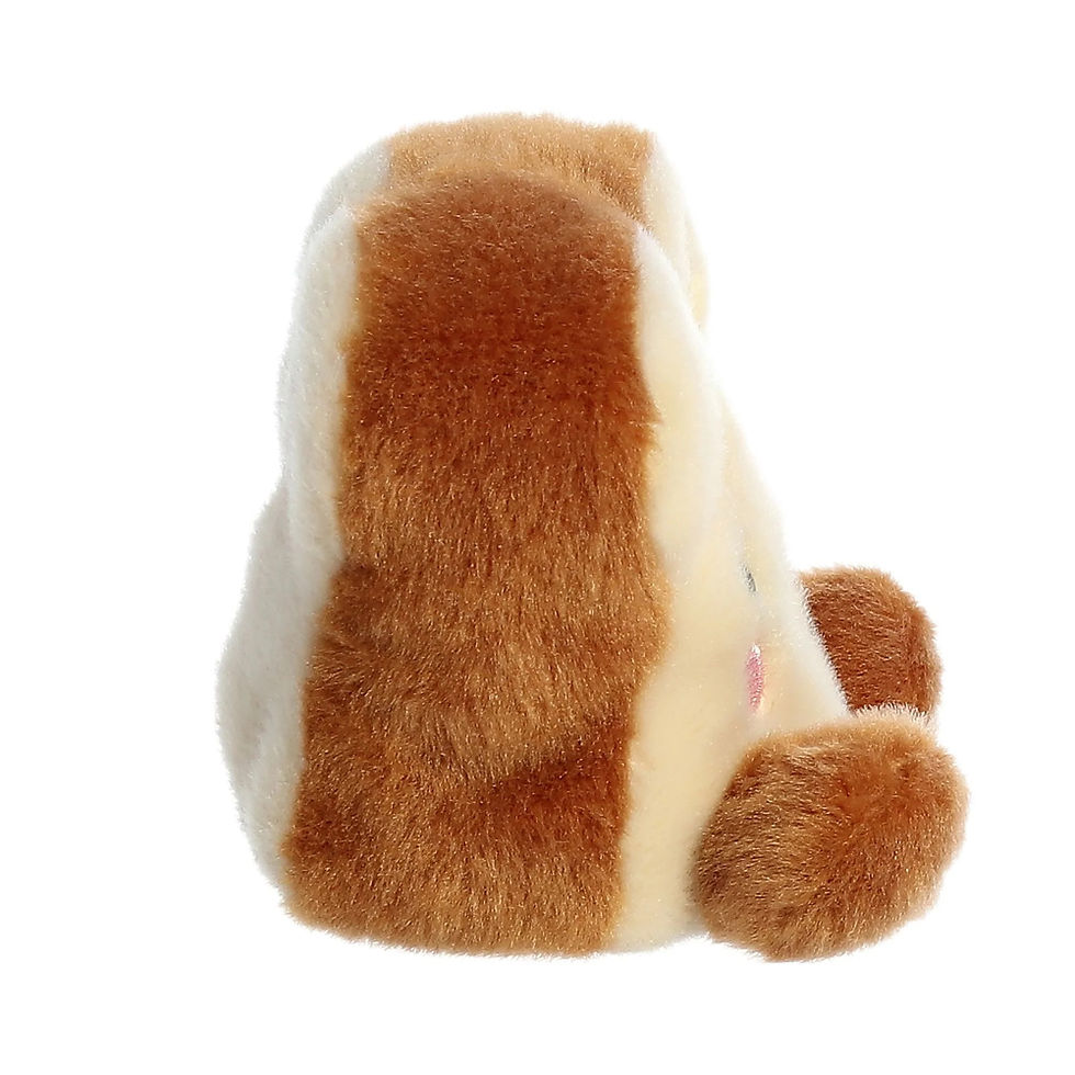 Side view Palm Pals 11cm Buttery Toast plush toy. Features light body and back with brown crust, pink cheeks and yellow doto