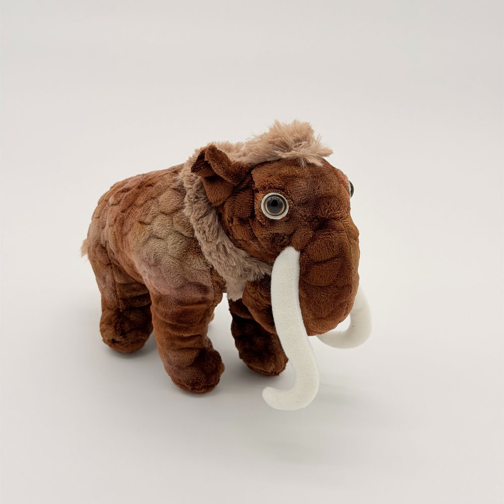 Front view Huggable Toys 20cm Woolly Mammoth plush toy with soft patterned brown fur, fluffy tuft of hair and curved tusks.