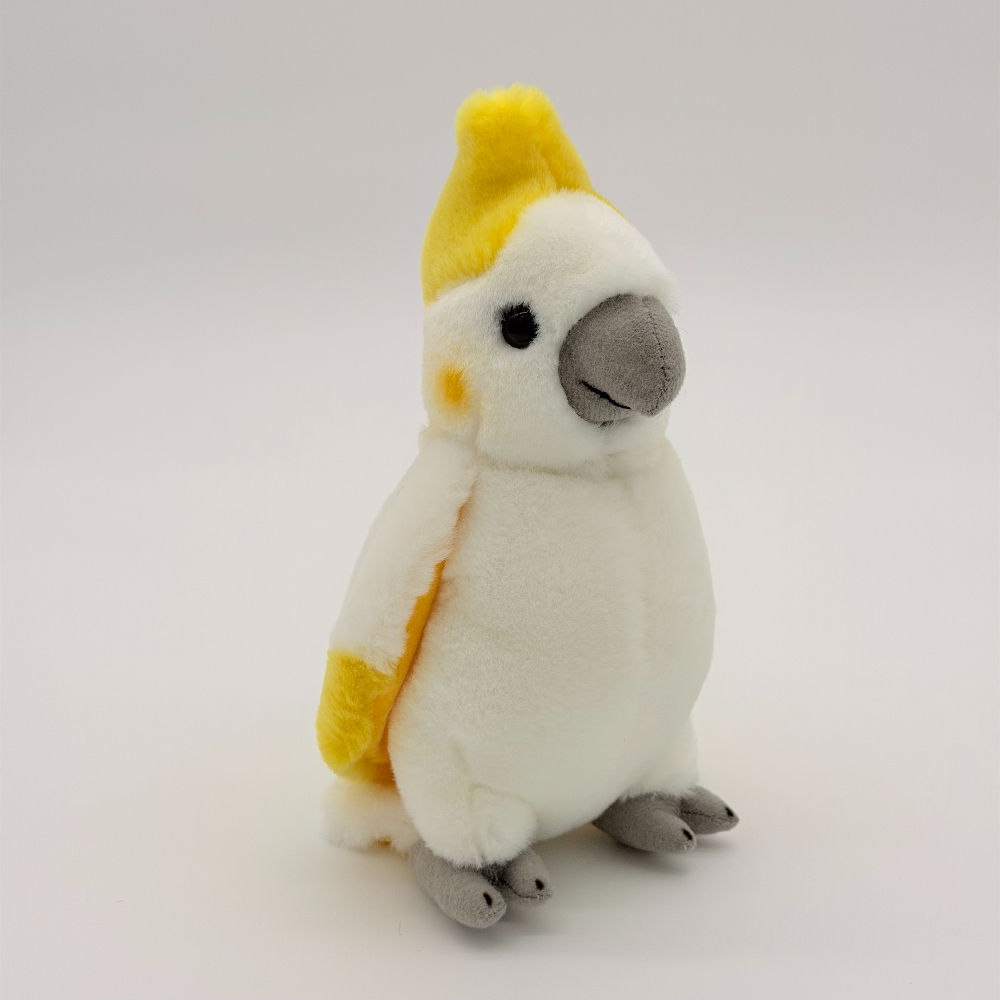 Front view Dinki Di 19cm Cockatoo plush toy with soft white fur, gray feet, yellow crest and tip of wings
