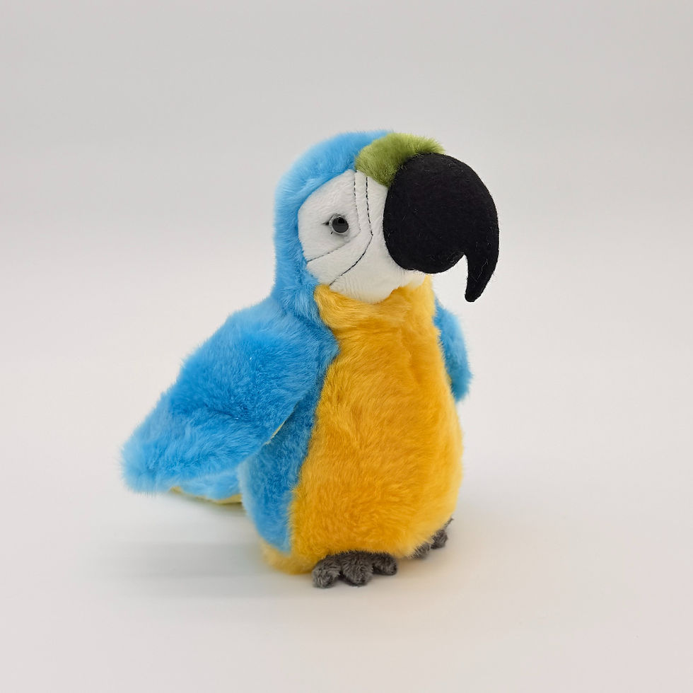 Front view Lil Friends 18cm Blue Macaw with soft pale blue fur and wings, yellow breast, white face and black beak
