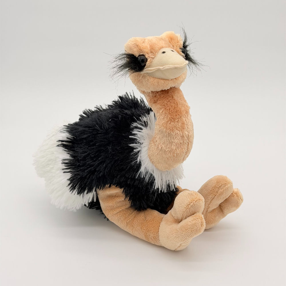 Front view Wild Republic 30cm Ostrich plush toy with soft black fur body, fluffy white wings, beige head and legs, big eyes
