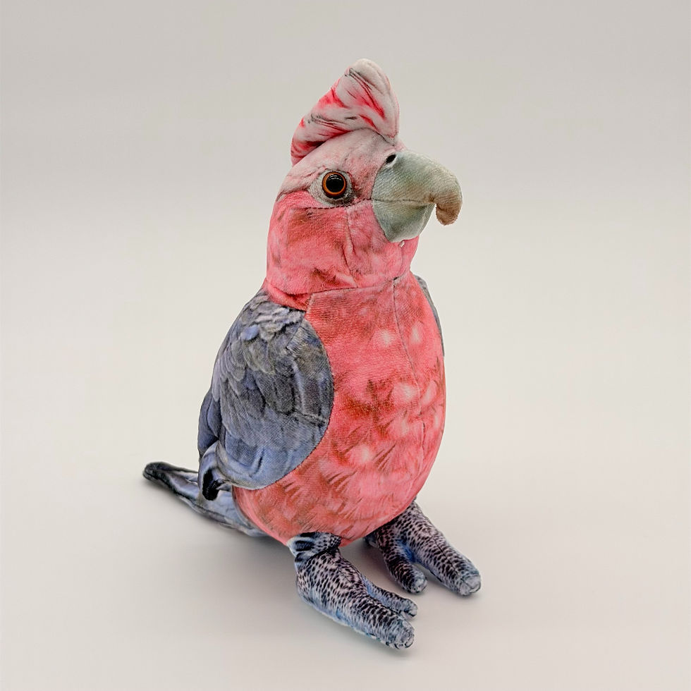 Front view Huggable Toys 23cm Galah plush toy with soft pink and gray fabric, large beak and mottled crest.