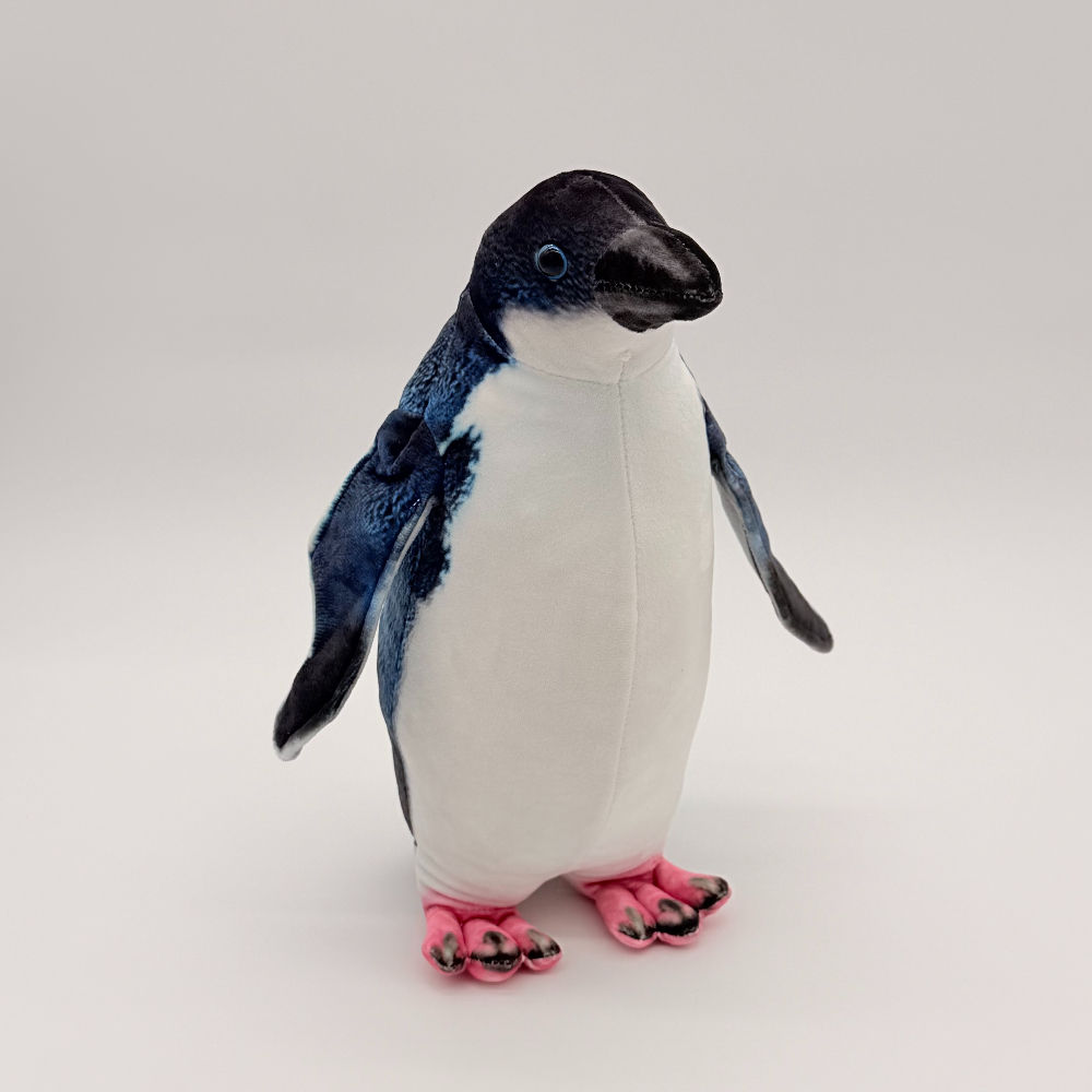 Front view Huggable toys Fairy Penguin plush, soft velvety navy & white body, a cute face with bright blue eyes and pink feet