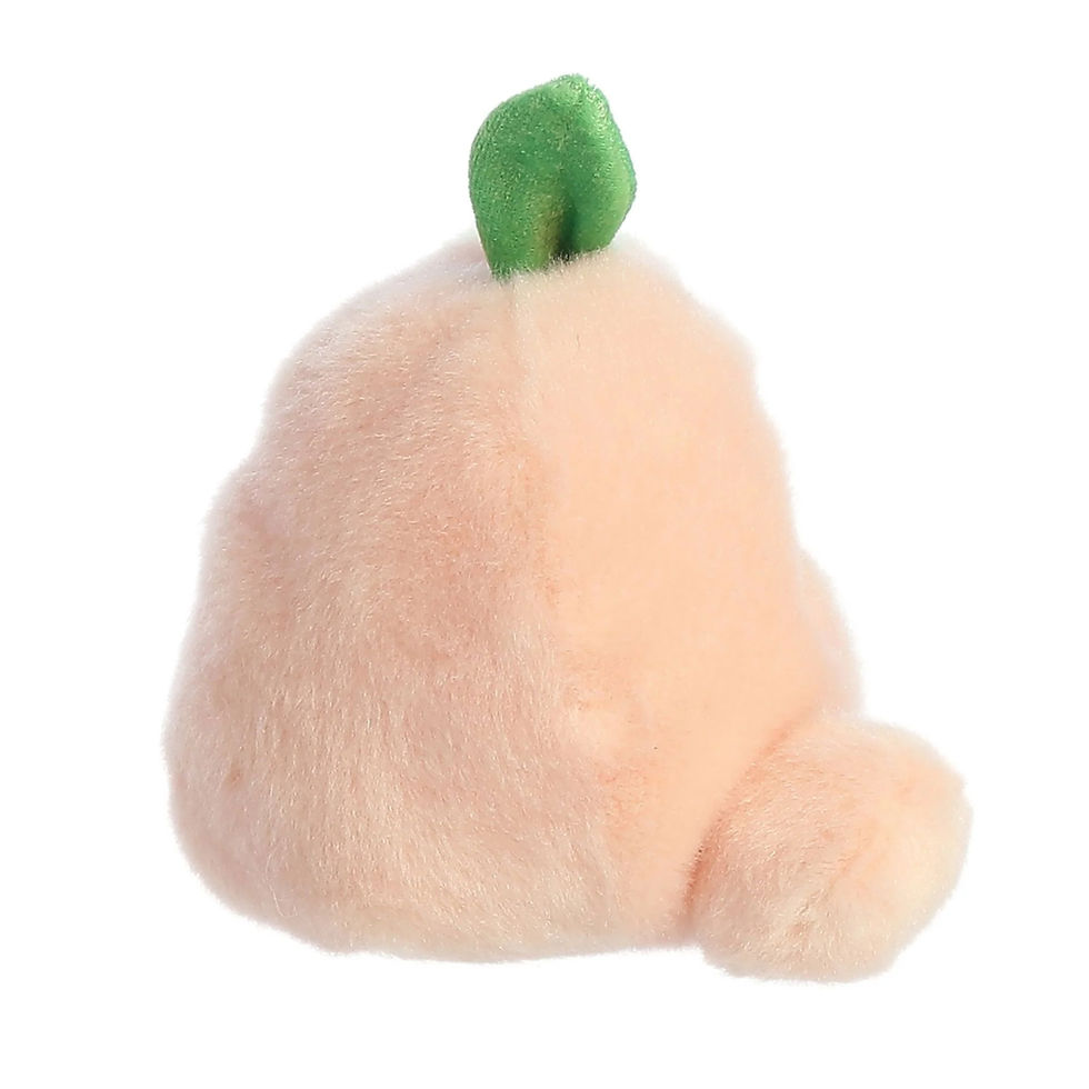 Side view Palm Pals 13cm Mellow the Peach plush toy features soft peach coloured fur, pink cheeks and green leaf on top.