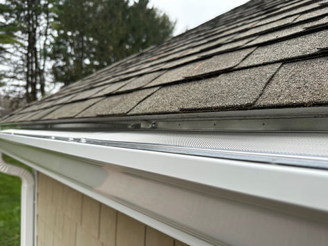 white gutter with hydro flo gutter guard installed