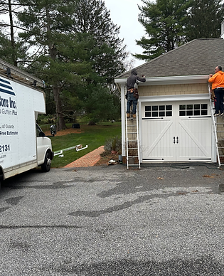 Shepherd & Sons Seamless Gutters Plus crew actively installing new seamless gutters on a home in Towson, MD – call (410) 737-2131 for free estimate – MHIC #51349 licensed & insured