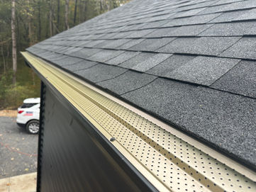Leaf Relief gutter guards installed on newly install black 5 inch k-style gutters today in Maryland by Shepherd & Sons.