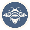 The Soul Sanctuary logo. A white bee in a blue circle.
