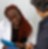 Busayo Ajasa, certified menopause specialist at Essential Medspa, consults patient.