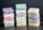 Close-up view of handcrafted soap bars stacked in soft light