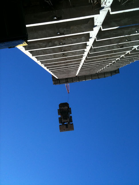 Craning Bobcat from Street level, over hauding, 3 levels down into carpark.jpg