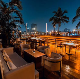 Rooftop view of Escobar Mumbai with dance floor and city skyline