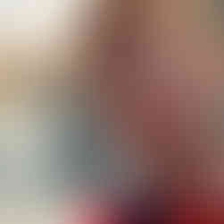 A ginger man in front of a venetian canal