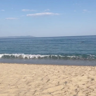 Blue sky, bluer sea, white(ish) sand