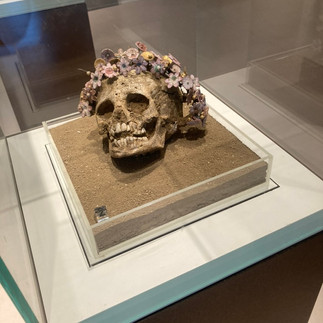 A skull garlanded in flowers