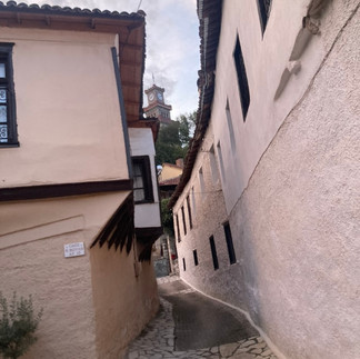 An old byzantine castle between uneven houses