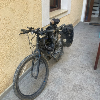Battered bike leaning on a wall