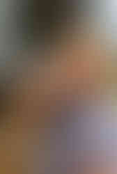 A belgian man drinking an Albanian beer