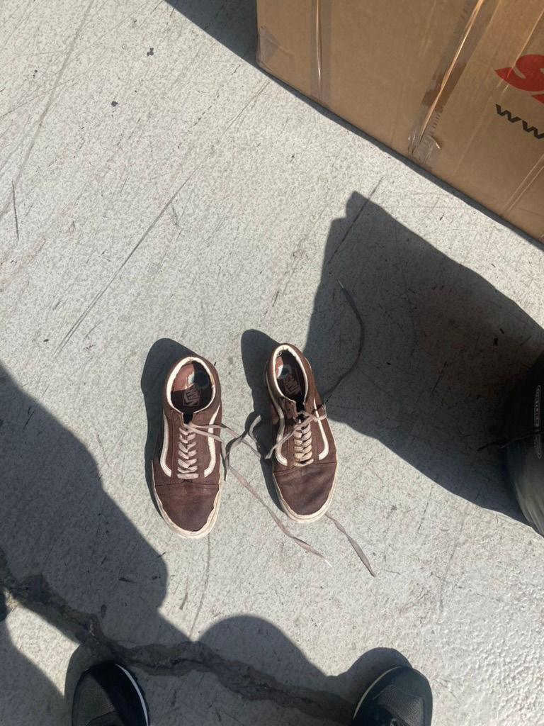 piss soaked brown vans about to go in the bin
