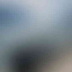 A bicycle in front of lake garda with hills behind