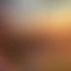 Me in front of the sunset over the distant sea