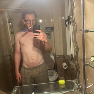 Me looking skinny brushing my teeth