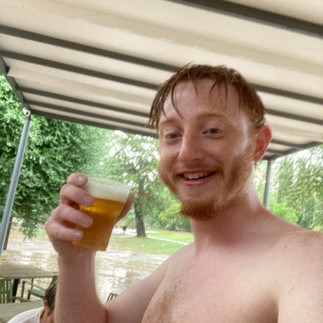 soaked through shirtless me drinking a beer