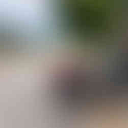 A bike with a steep hill and view of green mountains behind