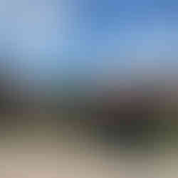 A bike in front of a croatian roof and the sea