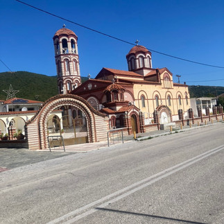 A red tile orthodox church by the road