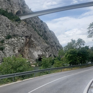 A road with a thin bridge above it