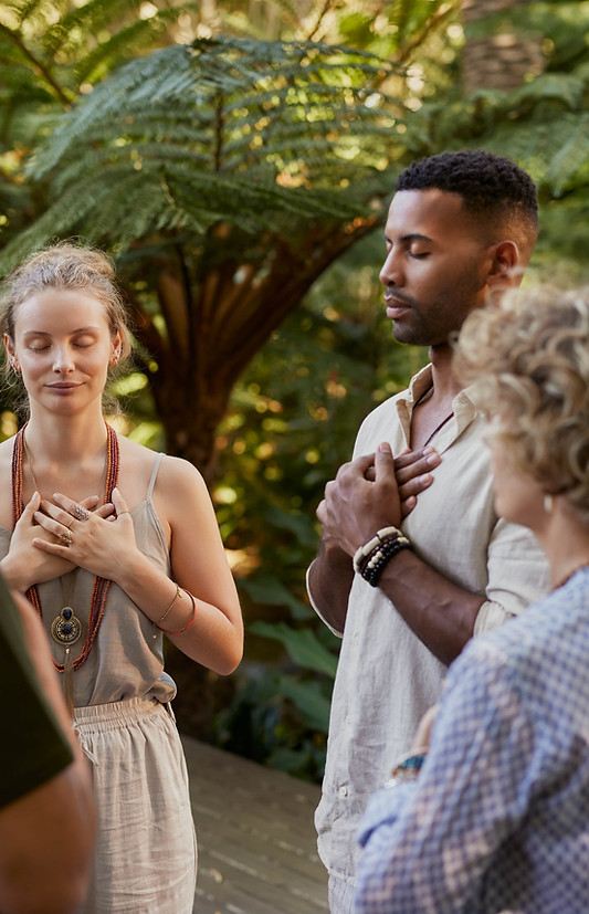 Group participating in a mindful meditation session outdoors