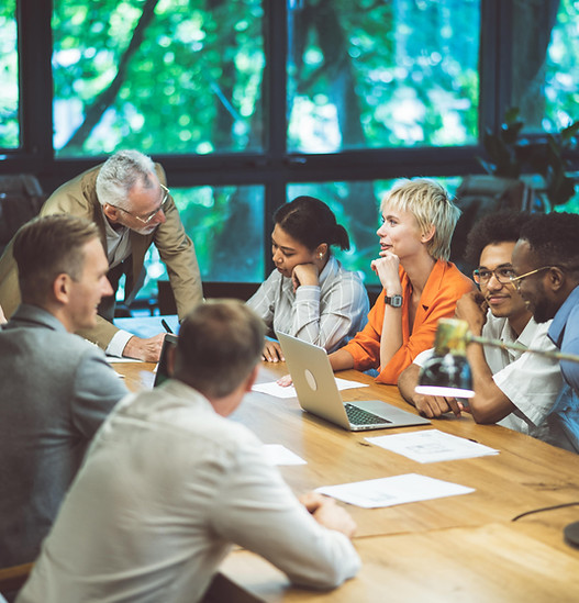Corporate team meeting around a conference table during a planning session