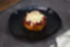Eggs Benedict topped with hollandaise on toasted brioche