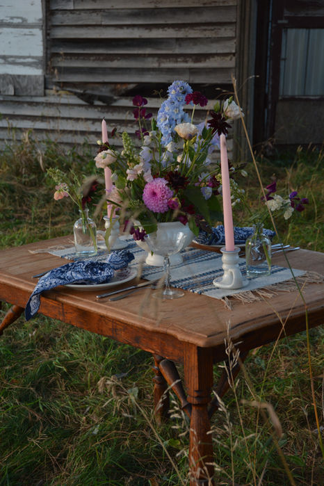 whimsical outdoor wedding flower table arrangement
