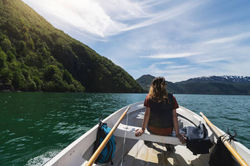 Woman mountains water