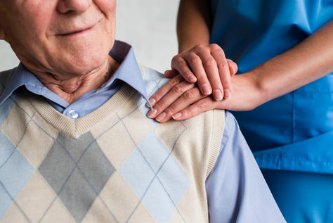 nurse-holding-old-man-s-shoulder-close-up.jpg