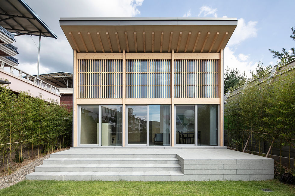 Completed in 2024, INKYO is a small, 49-square-meter house in Daegu, South Korea, designed by DHPA. Created as a vacation home for an elderly couple who often visit Daegu, the project provides a comfortable and familiar space for them and their visiting family. The house is situated on an elevated eastern side of the plot to maximize yard space on the western side, which faces a public park.
The design is notable for its dynamic, sloping roof, which was chosen to both prevent leaks and create an open, airy interior. The roof is cut into sections to allow natural sunlight to enter the bedrooms and bathrooms on the south side, reducing the need for artificial lighting and causing the internal atmosphere to shift throughout the day. The high-ceilinged living room is positioned to overlook the yard and the trees in the park beyond, enhancing the sense of openness.
The interior layout was designed to maximize the feeling of space, with an open flow between the living room, kitchen, dining area, and a lofted attic. This design creates a minimalist and cohesive living environment.
Credits
Architects: DHPA (Dohyun Park)
General Contractors: Etern A&C
Structural Engineers: Wheean Structural Engineering
Photographs: Kiwoong Hong