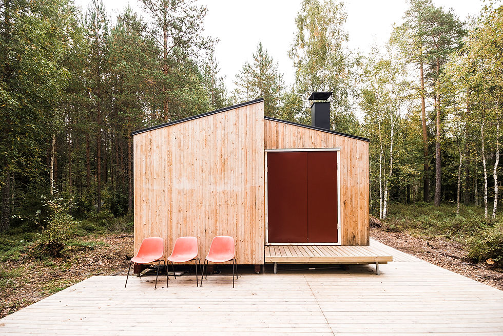 "Constructed by architecture and urban design students Timm Bergmann and Jonas Becker, who would later go on to found Studio Politaire, the ""Small but Fine"" Off-grid Cabin was completed in 2018 in a remote forest in Finland. The 280-square-foot structure was built on a modest budget of approximately $14,000, with the designers doing most of the work themselves. The off-grid cabin was designed as a simple and functional retreat to live in and reflect on self-reliance.
Built on a rocky plot with a natural flat spot near a lake, the cabin’s design features four slightly offset rooms spread across a total floor space of 26.8 square meters, offering a different view of the surrounding landscape from each staggered window. The cabin's off-grid utilities include a water pump, a three-phase sewage system, and a hot water supply powered by solar energy and a wood-burning stove. To accommodate the cabin's location on swampy soil with no vehicular access, the designers first built a 650-foot-long elevated pathway to the nearest road. The foundation was built using concrete-filled steel pipes anchored into bedrock to ensure durability.
The minimalist interior features wood-paneled walls and flooring, with plywood boards lining the ceilings. A wood-burning stove provides heat, while large windows allow natural light to flood the space and connect the occupants with nature. A small deck outside provides an open-air area for a tranquil retreat.
Credits
Architects: Timm Bergmann and Jonas Becker (Studio Politaire)
Photography: André Boettcher, Studio Politaire"