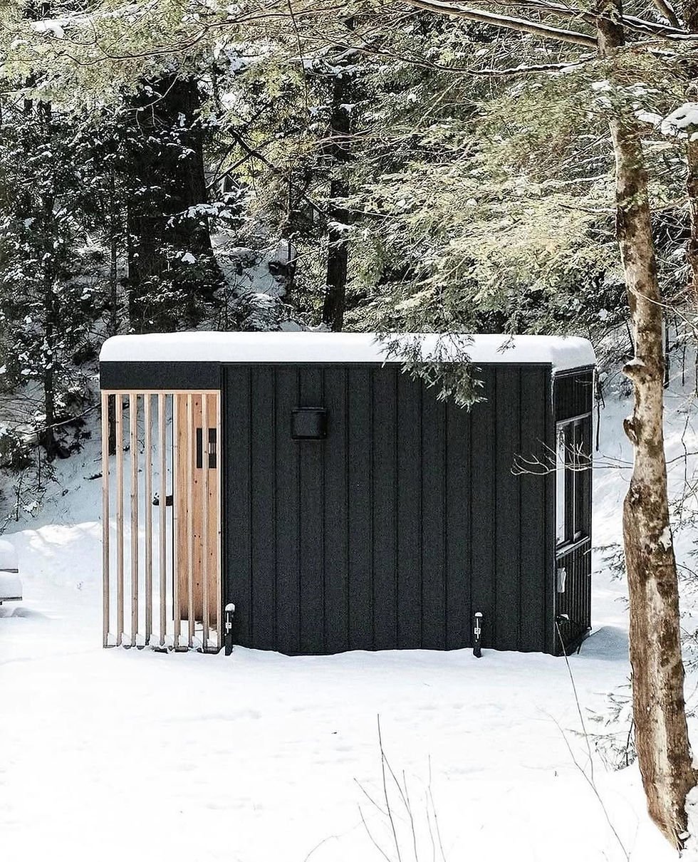 Cécile Lodge is a modular, off-grid tiny home built by Go-Box, located in a wooded area in Lac-Mégantic, Quebec. Designed as a prototype for a new resort project, the lodge is intended for adventure lovers, offering ski-in/ski-out and bike-in/bike-out access. The project emphasizes a strong connection to nature and a flexible, space-efficient living experience, inspired by the "van life" movement.
The Go-Box design philosophy revolves around offering portable, prefab structures that can be combined and customized. For Cécile Lodge, the clients needed a small space with large floor-to-ceiling windows to invite the outdoors in. The result is a highly functional interior that incorporates movable, built-in furniture, reminiscent of a game of Tetris. A key feature is the convertible living area, which uses a pull-out bed to transform the main space into a large bedroom at night, suitable for a couple with two children.
The interior boasts a simple aesthetic with finishes made from either Russian ply or pine. A small kitchenette is integrated into the layout, featuring a gas stove, kitchen accessories, and a mini-fridge. A full bathroom with a toilet and shower is also included. Outside, the lodge is finished with a low-maintenance steel exterior and a cedar or pine terrace, while inside, comfort is ensured with insulation and the option for a heat pump and heated floors.
Located in the forest with mountain views, Cécile Lodge is off-grid but is equipped with a well and septic system. It serves as a retreat for those who wish to disconnect from daily life, refuel their energy, and immerse themselves in the surrounding natural environment.
Credits
Designer and Manufacturer: Go-Box (Emelie Holmberg)
Location: Lac-Mégantic, Quebec