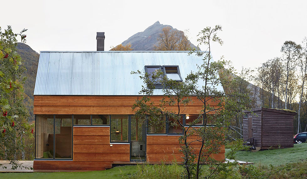 The Cabin Laksvatn is a 50 m² retreat located on the Lyngen Peninsula near Tromsø in northern Norway, in a region known for its dramatic alpine landscape. Designed by Oslo-based Hamran/Johansen Arkitekter and completed in 2014, the cabin provides a comfortable and spacious accommodation for a large family with a total of nine beds, despite its modest footprint.
The design was a creative response to the challenge of accommodating many people on a tight budget. The architects cleverly limited the net floor area to 50 m² to comply with Norwegian building codes, which impose additional technical demands on larger cabins. The solution involved utilizing the space beneath the pitched roof, where the low ceiling height does not legally count as floor area. This loft space was ideally suited for sleeping quarters.
The cabin presents a contemporary take on a traditional form, with its classic pitched roof complemented by the use of extra-wide wooden cladding and large windows. The exterior cladding is made from glulam panels treated with natural pine tar, which will weather over time to blend with the natural surroundings.
The interior is functional and minimalist, featuring exposed timber framing and knot-free pine paneling. The ground floor is constructed from in-situ cast concrete, which follows the natural terrain and defines the transition between the indoor and outdoor spaces.
The loft space, measuring just 14 m², cleverly accommodates three single beds and two double beds. An additional double bed is located in a bedroom on the ground floor. To maximize light and create an immersive experience, the windows reach to the ceiling on the upper section, while their height variations at the bottom are strategically aligned with specific functions and views. A large window band offers panoramic mountain views in nearly every direction.
A minimalist, cantilevered staircase with thin steel plates provides access to the loft, and an open steel grating on the upper level filters light from a skylight, emphasizing the cabin's verticality.
The design draws on the features of a previous, dilapidated family cabin from 1942 that was on the same site, reinterpreting elements like its corner windows and exterior cladding.
Project credits
Architects: Hamran/Johansen Arkitekter (Lars Hamran and André Severin Johansen)
Client: Hamran/Johansen Arkitekter AS
Project Year: 2014
Location: Laksvatn, Tromsø, Norway
Photographers: Ivan Brodey, André Severin Johansen
Consultants: eStatikk AS