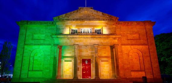 Cavan Court House illuminated with green, yellow, and orange bespoke lighting by Callaghan Electricals