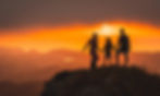 Family at sunset on a mountaintop, symbolising the freedom and reassurance Arcadia’s health insurance advice provides