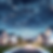 Starry night sky over residential neighborhood with a satellite flying overhead