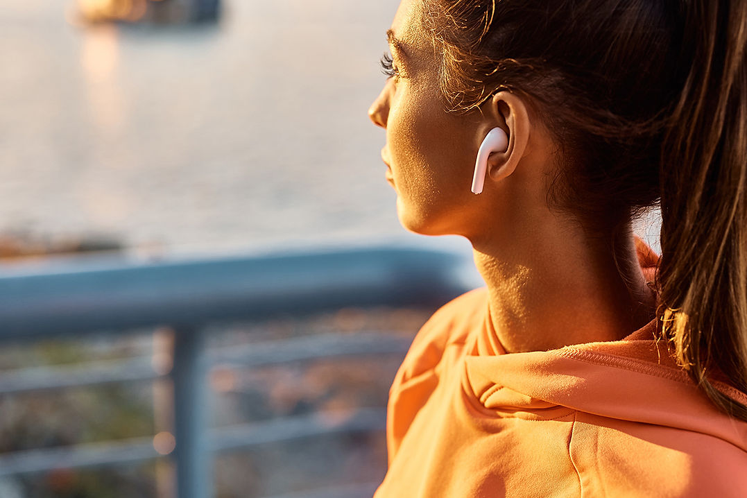 BTTB Spiritual Fitness Image of a lady working out with her headphones in