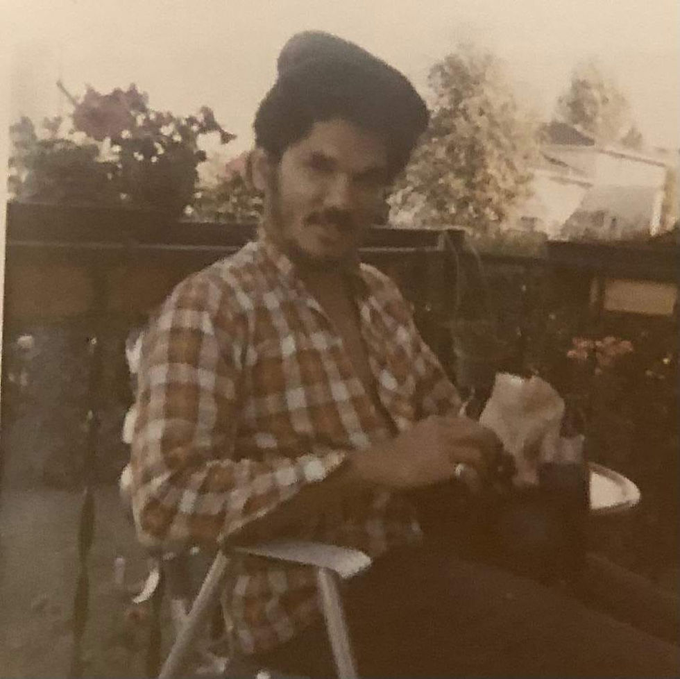 Old photo of father sitting in a chair